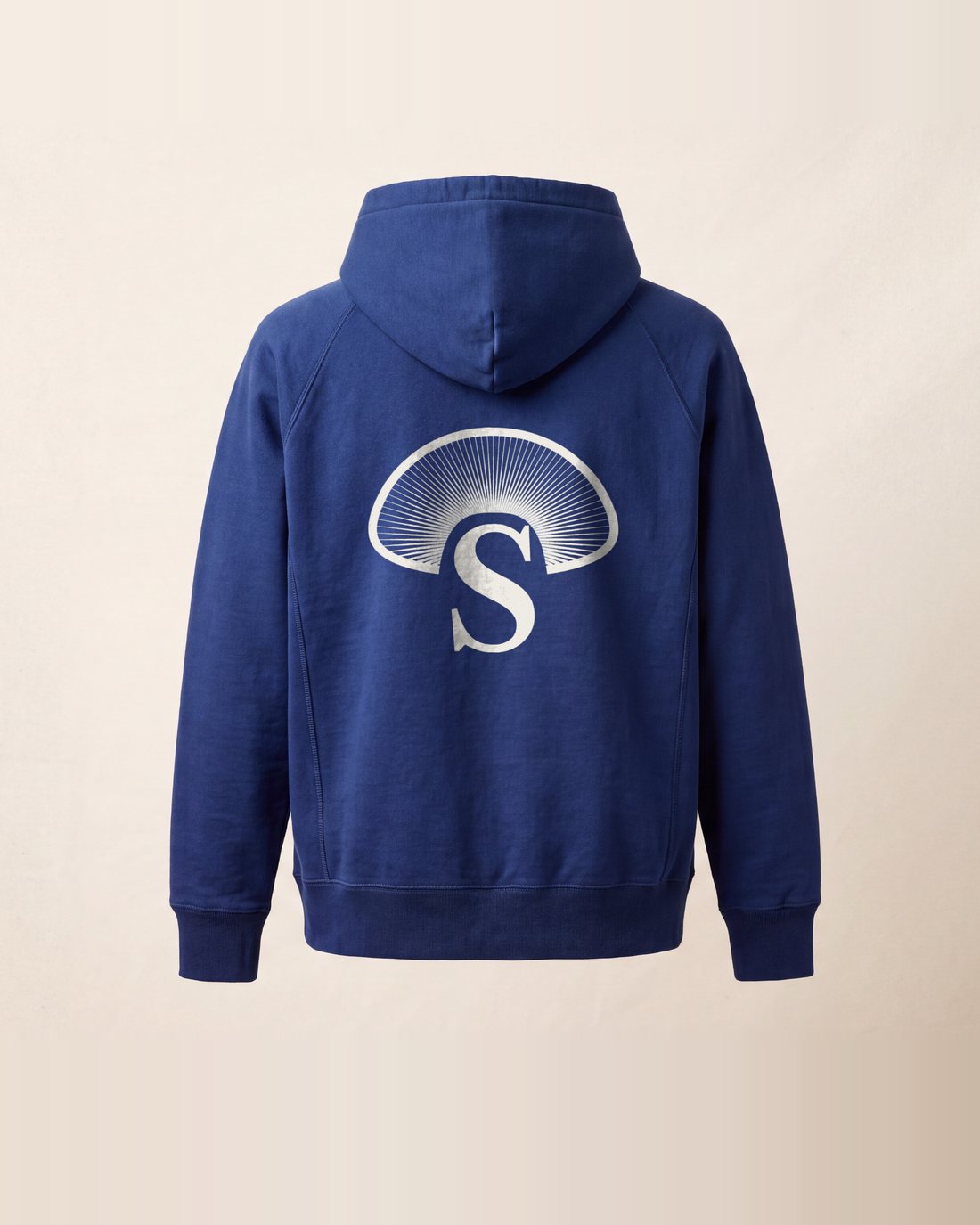 The indigo hoodie from the back: the Cap of Gills in raw cotton below the hood.