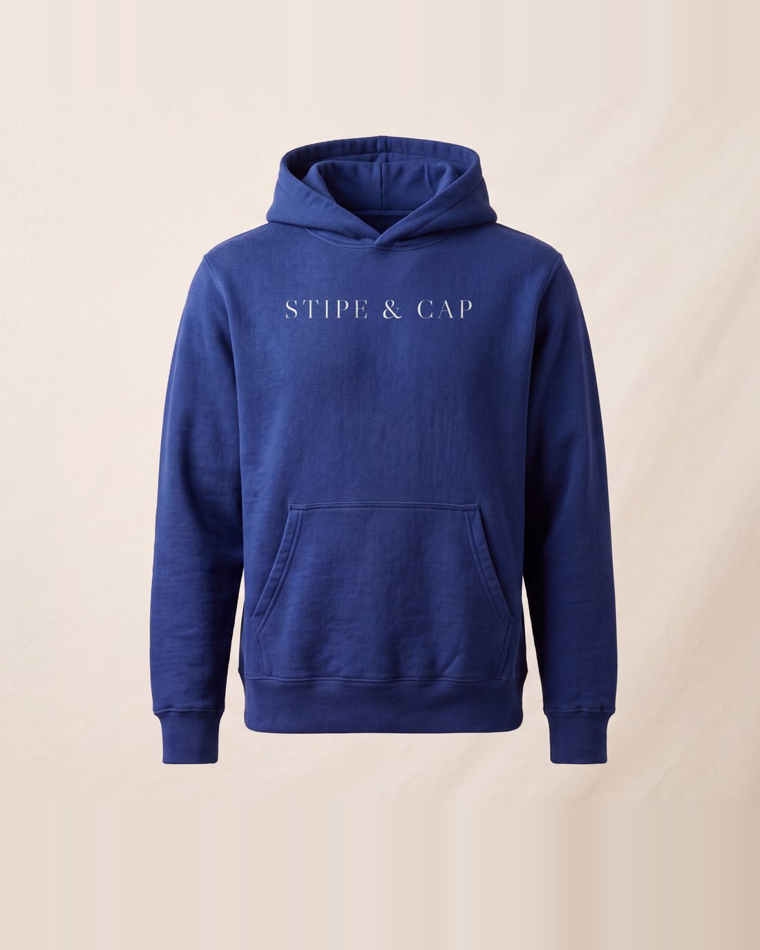 The indigo hoodie from the front: STIPE & CAP in raw cotton.