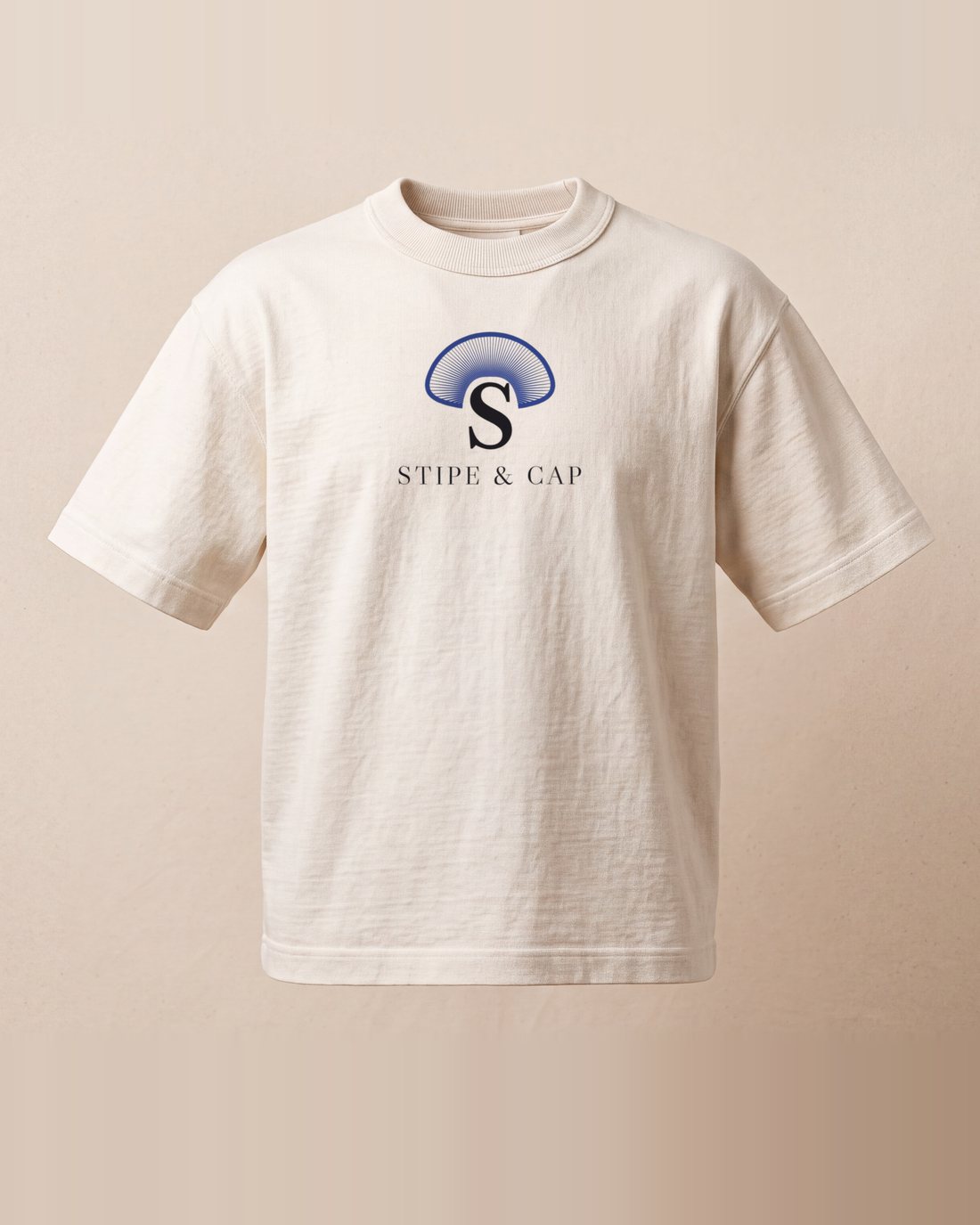 The raw cotton tee from the front: the Cap of Gills over STIPE & CAP, centre chest.